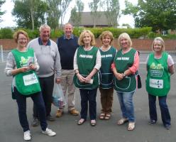 Troon Rotarians help Foodbank Volunteers collect for foodbank.